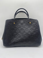 LOUIS VUITTON Excellent: This item is gently used Handbag