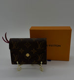 LOUIS VUITTON Excellent: This item is gently used Wallet