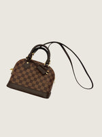 LOUIS VUITTON Excellent: This item is gently used Handbag