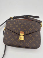 LOUIS VUITTON Excellent: This item is gently used Handbag