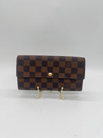 LOUIS VUITTON Excellent: This item is gently used Wallet